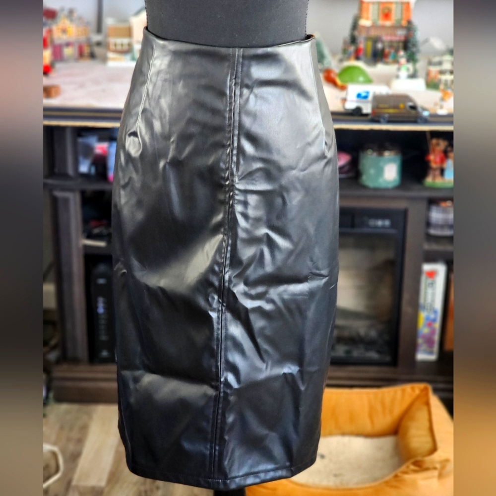 Faux Leather Skirt with back split, side zipper and polyester backing.
